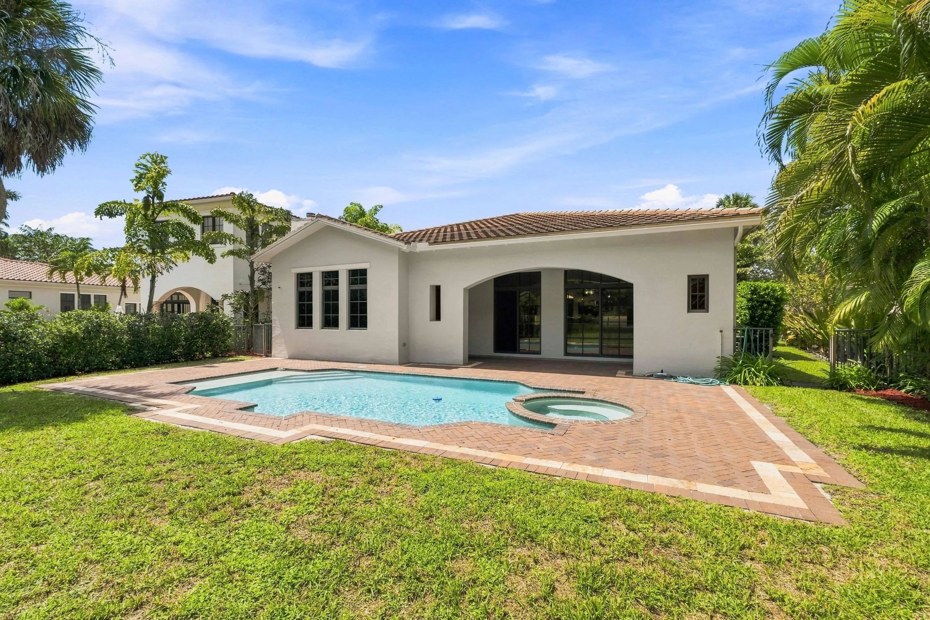 Pool and spacious backyard with landscaping
