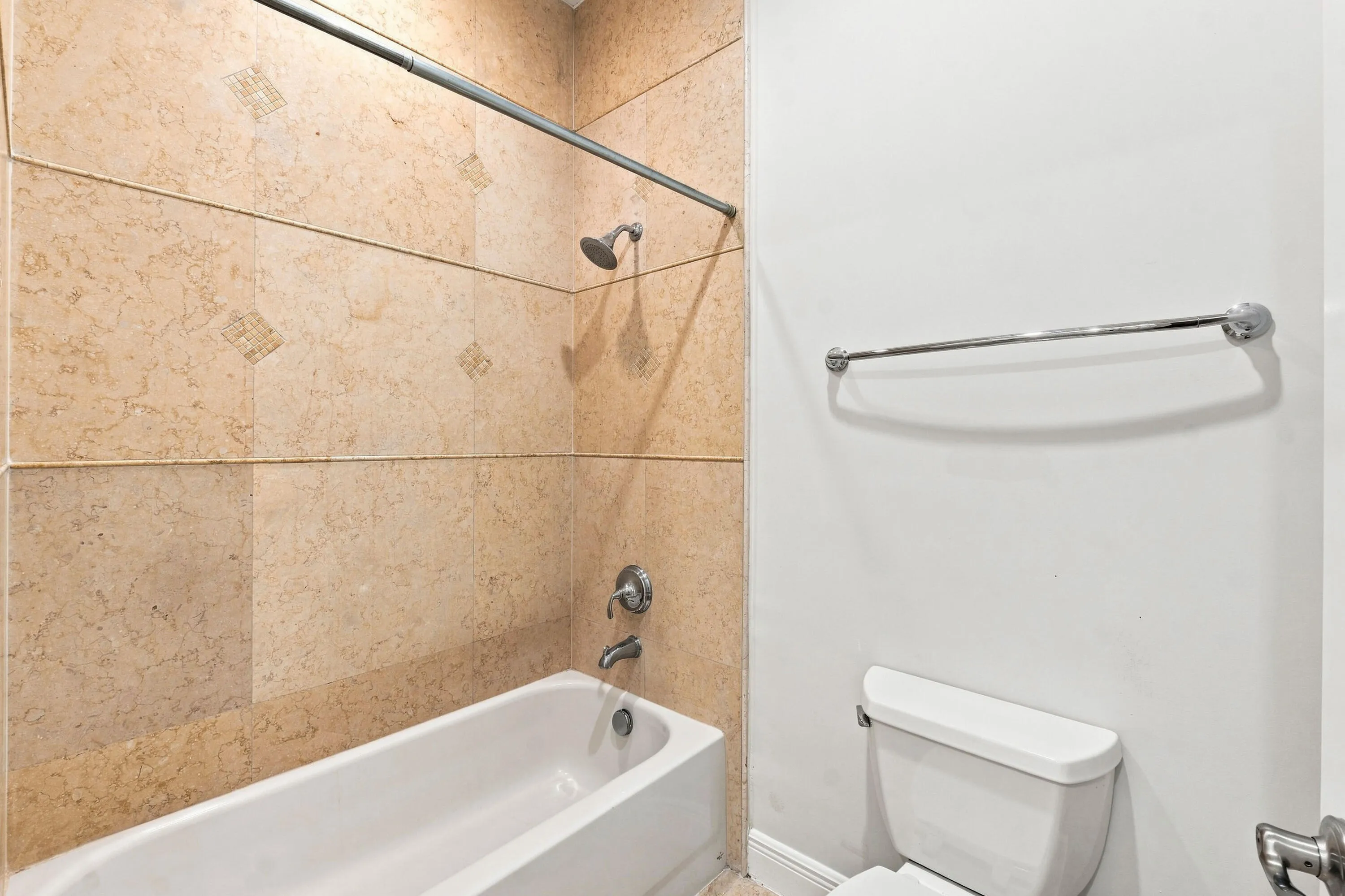 Updated bathroom with modern tile finishes