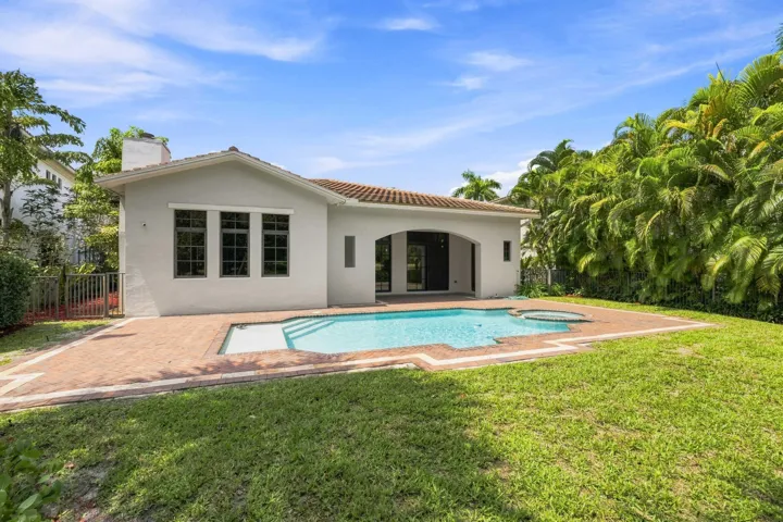 Freshly updated exterior with landscaped yard