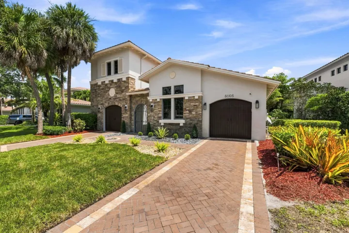 Fresh landscaping surrounding the front entrance