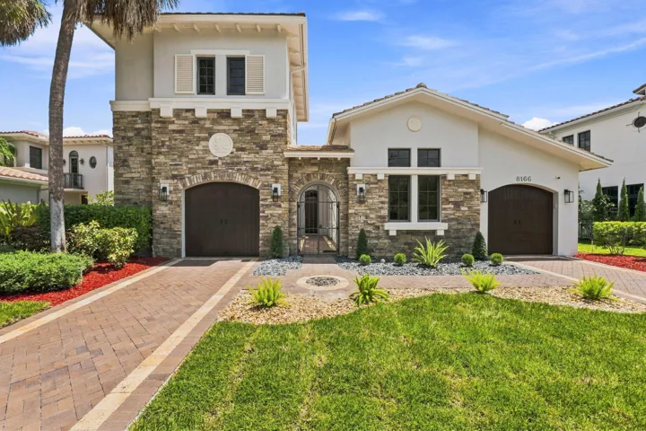 Well-maintained exterior with fresh landscaping