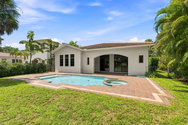 Pool and spacious backyard with landscaping