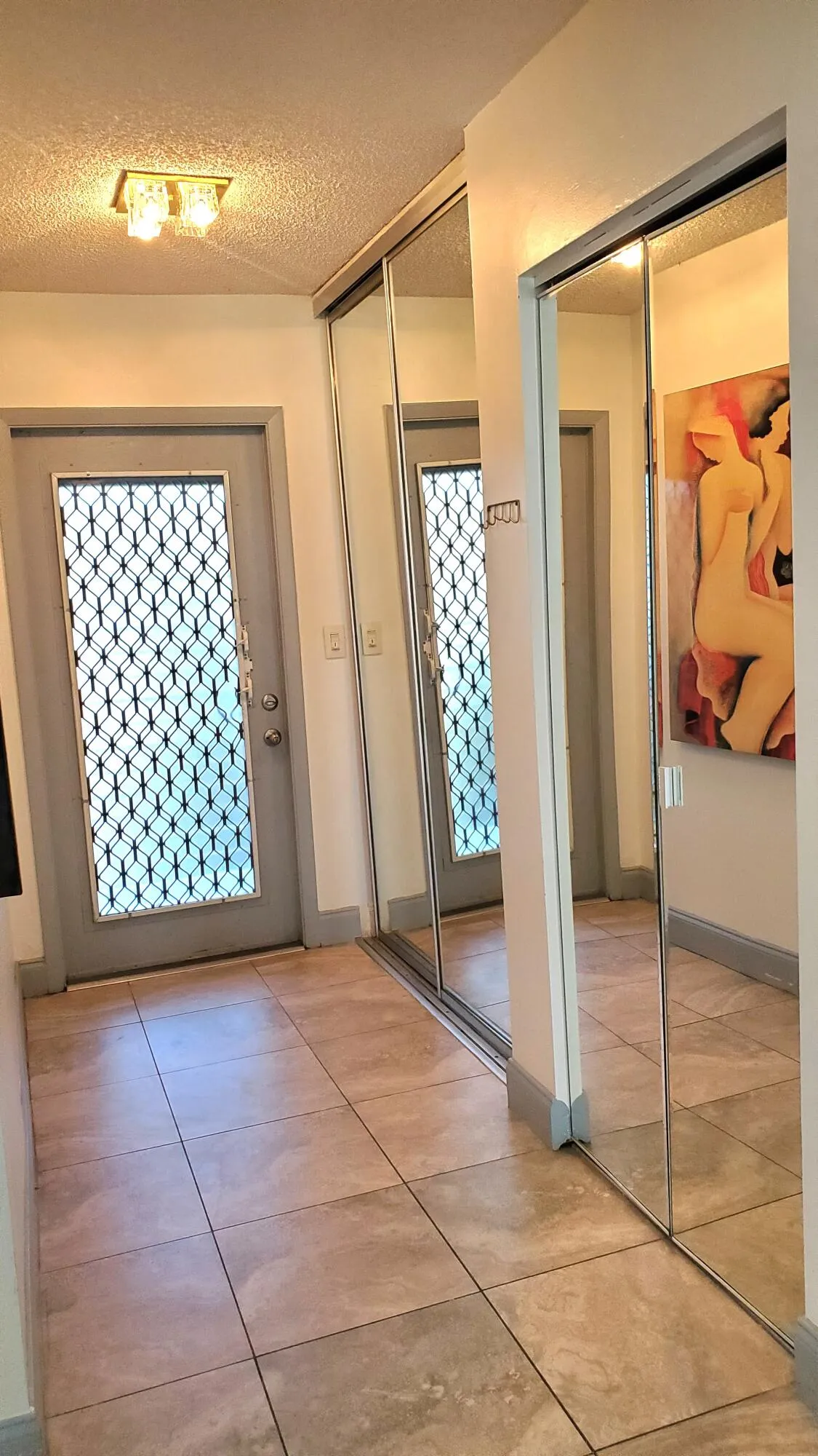Front Entrance Foyer With Closets And Mirrors