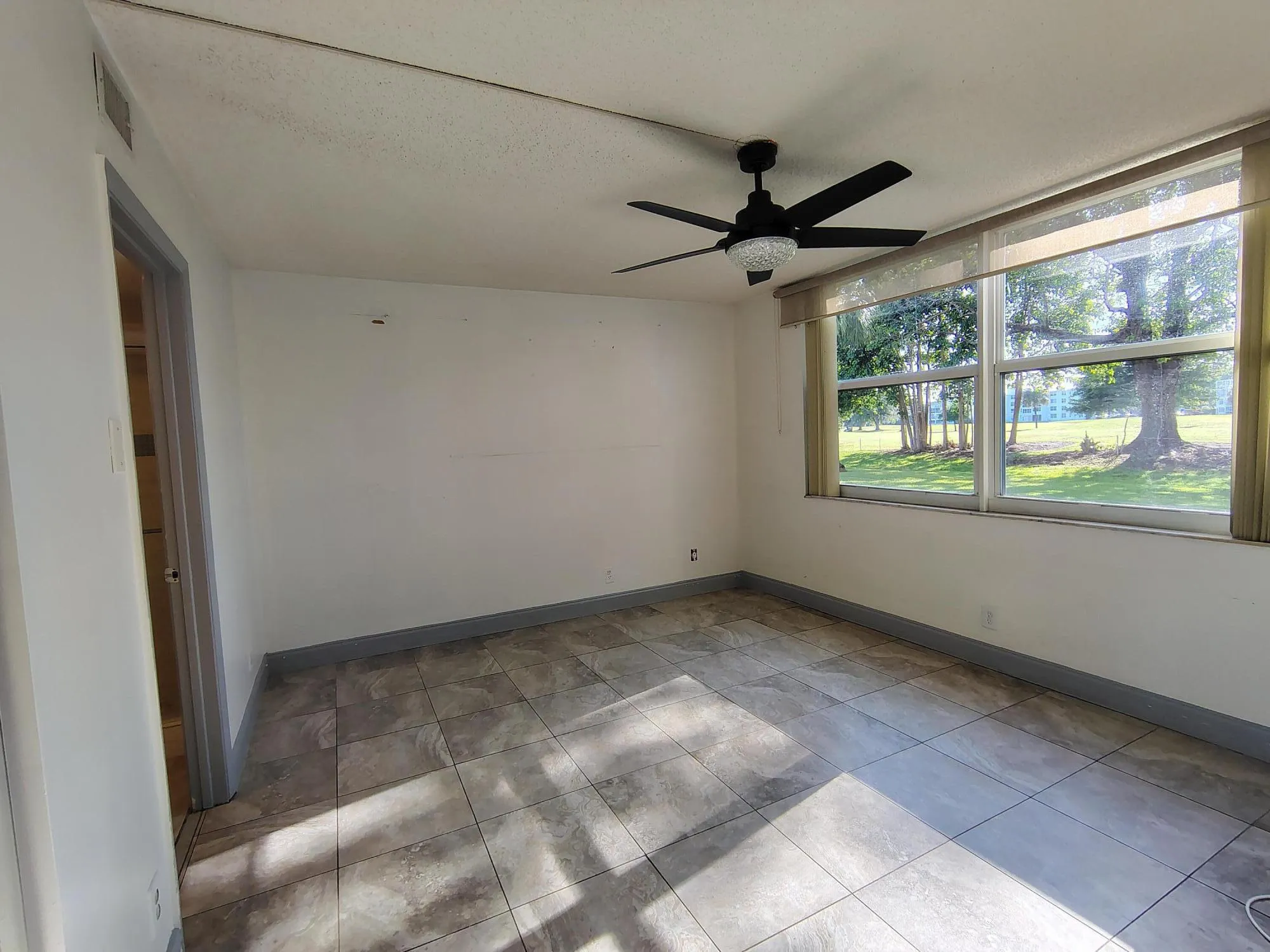 Bedroom with Huge Window for Plenty of Natural Light and Views to Golf Course