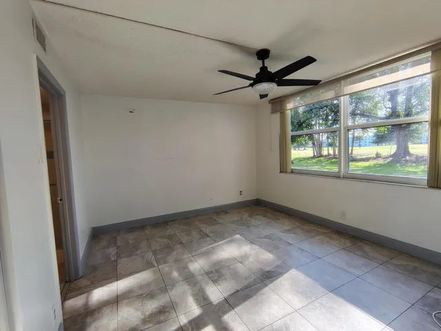 Bedroom with Huge Window for Plenty of Natural Light and Views to Golf Course
