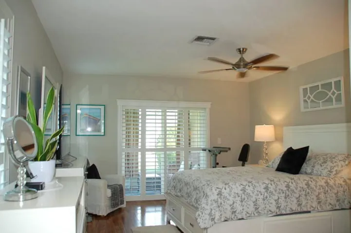 Bright Primary bedroom with access to the screened lanai