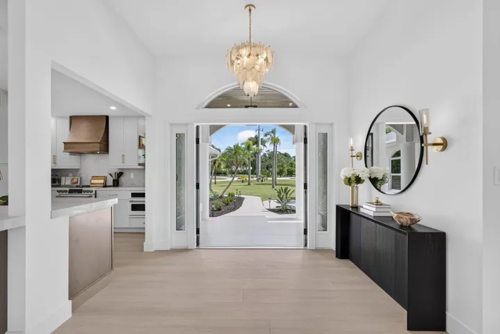 Double door entrance and custom chandelier