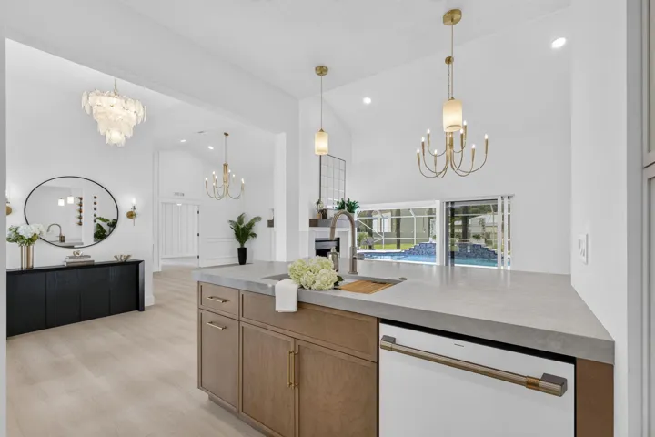 Custom cabinetry and hardware, quartz countertops, white GE cafe appliances
