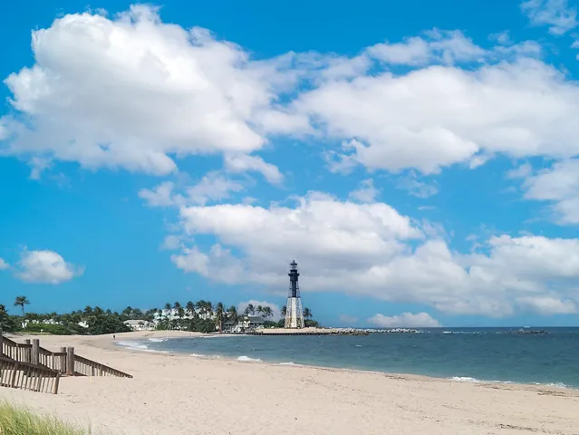 Expansive sandy beach with ocean frontage and beautiful lighthouse view