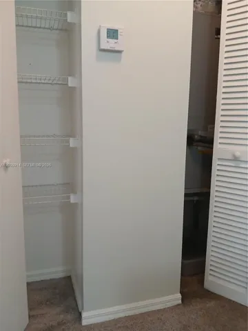 Linen Closet and AC closet in hallway between the two bedrooms