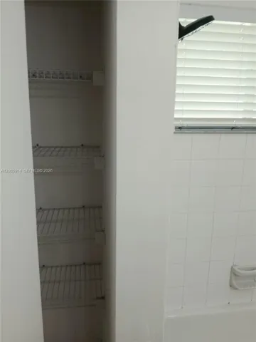 Bath closet behind entrance door