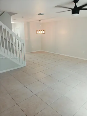 view from living room of the huge dining area off the kitchen