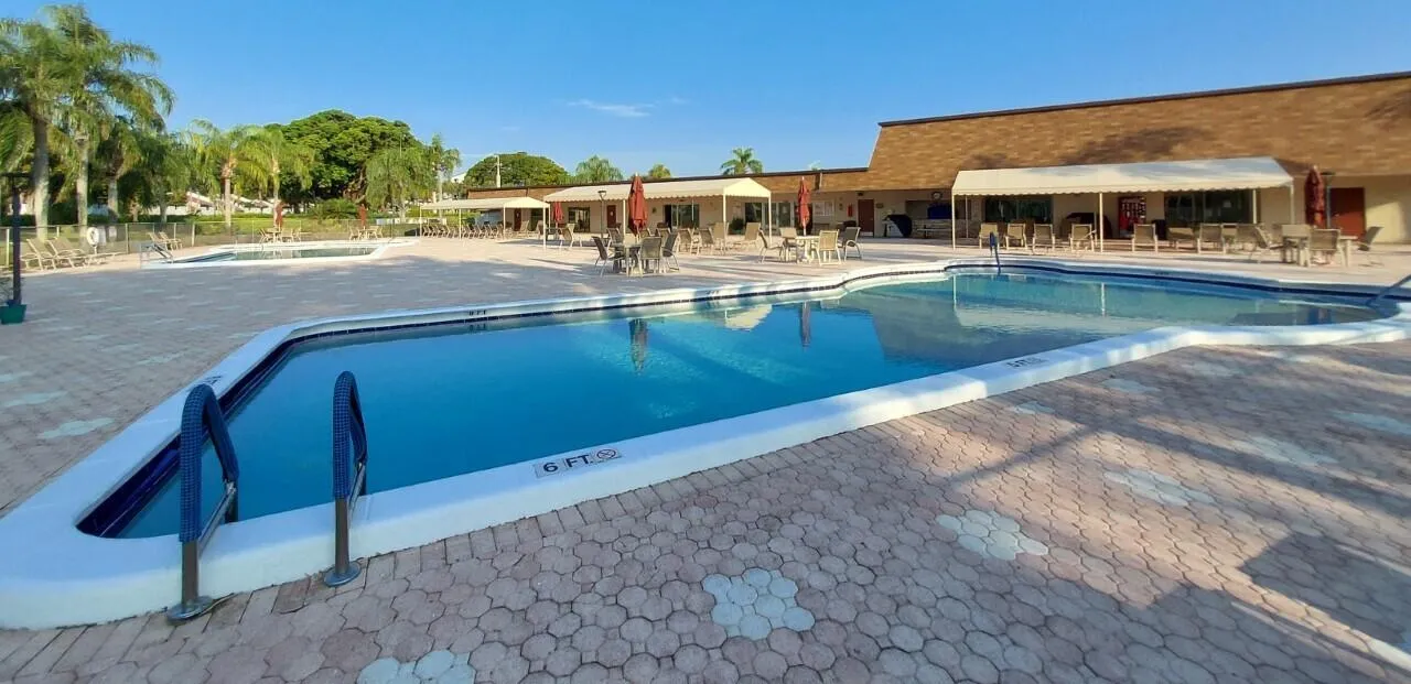 Two swimming pools and grill area