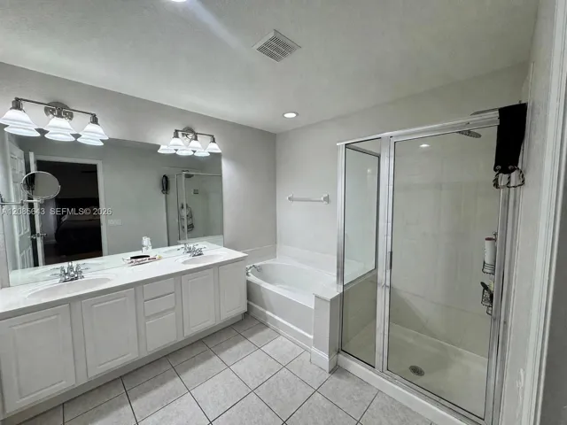 Master Bathroom inside Bedroom with dual sinks