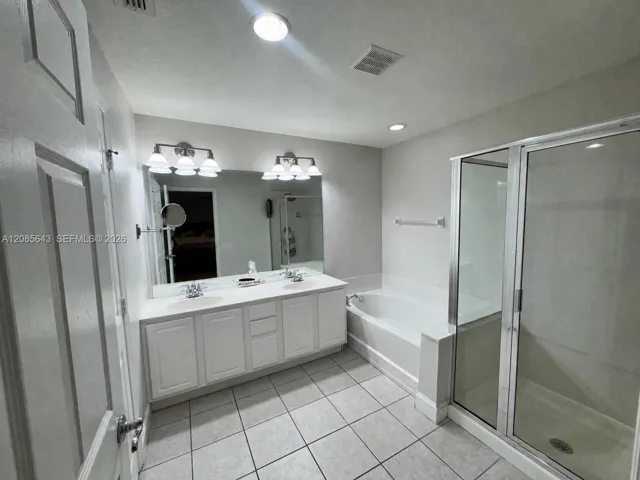 Master Bathroom inside Bedroom with dual sinks