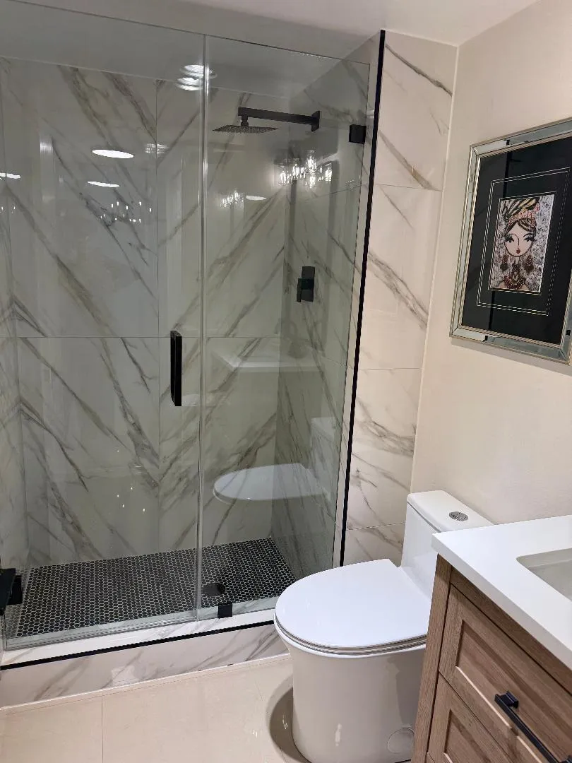 Custom porcelain wall tile installation with penny round on the floor.