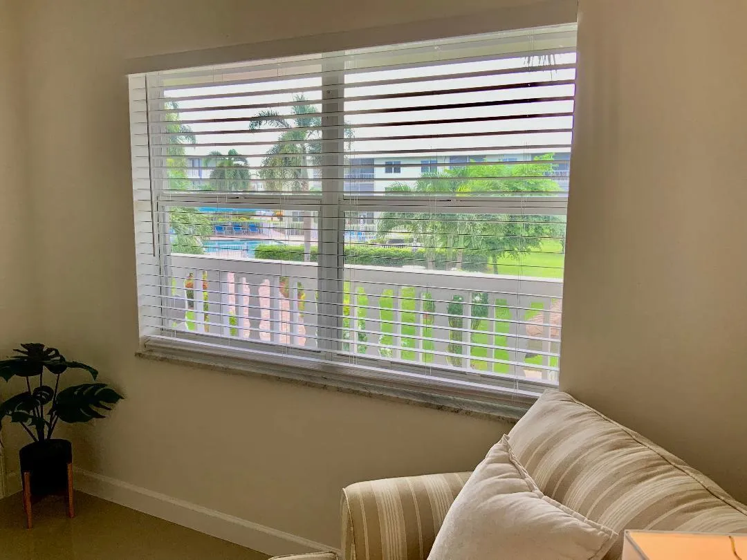 View of the pool and gardens from guest room