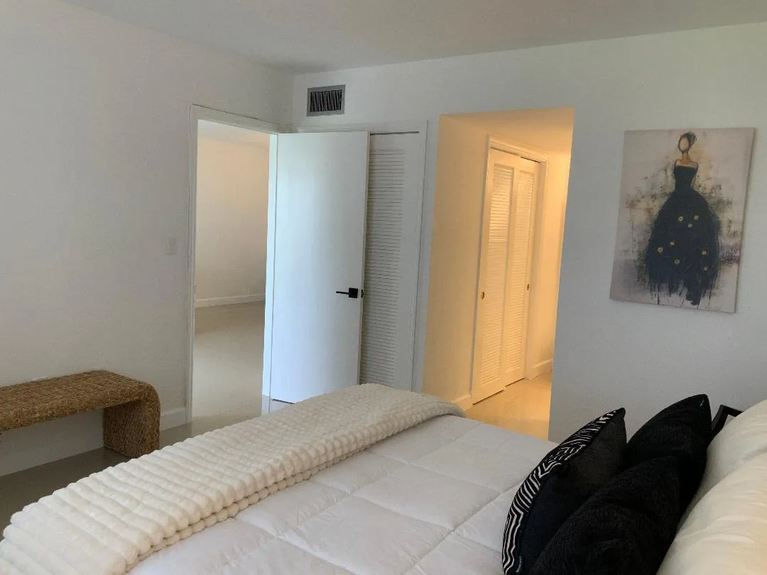 Master bedroom with walk in closet and his closet.