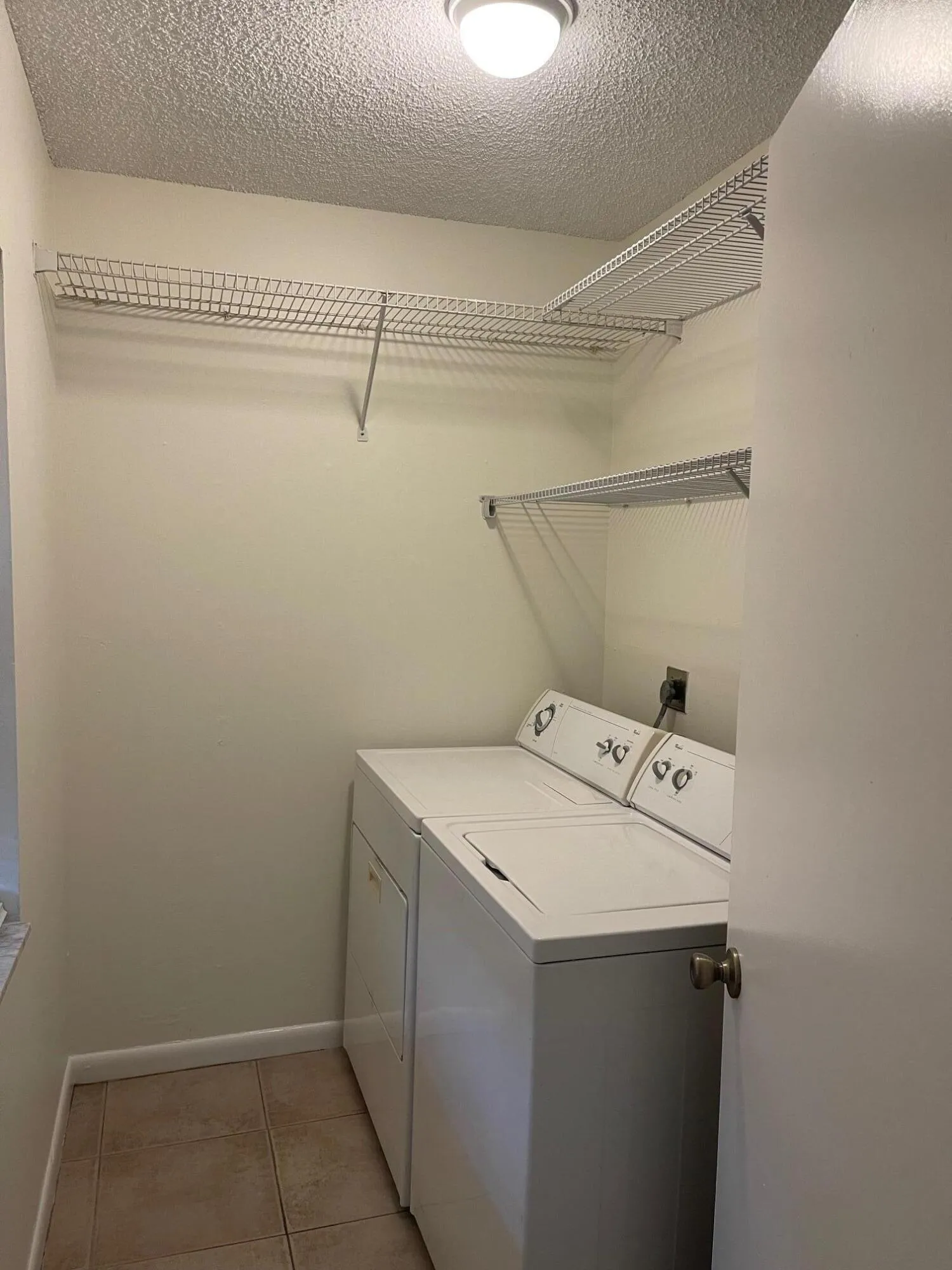 FIRST ROOM ON LEFT AS YOU ENTER IS THE LAUNDRY ROOM