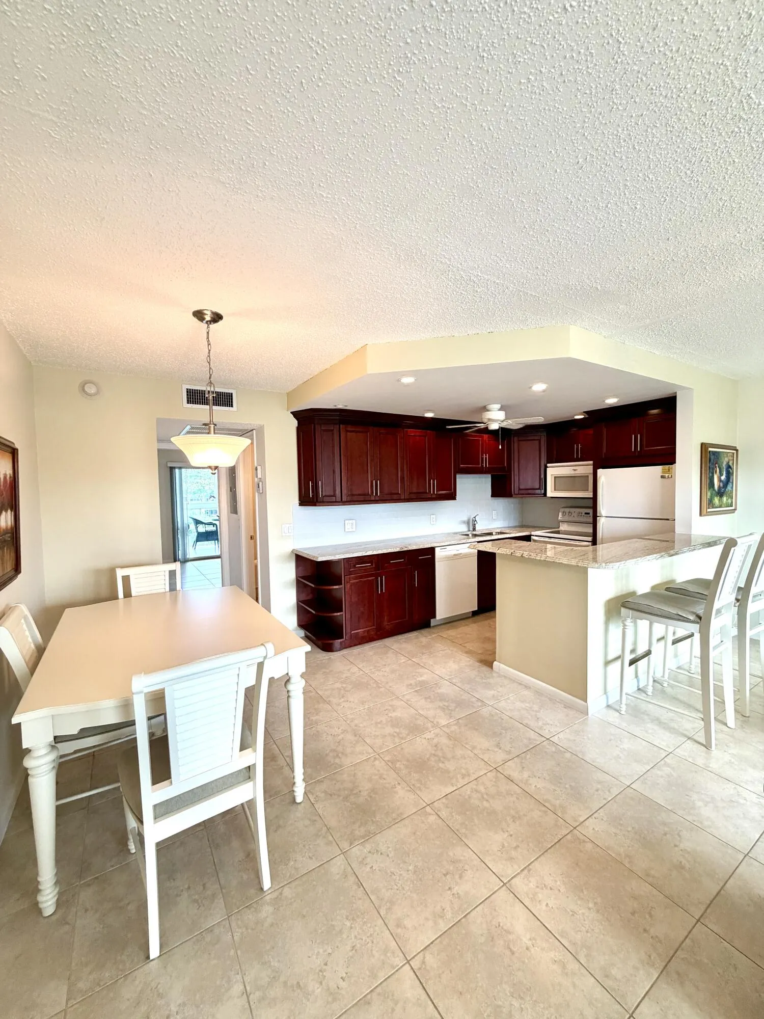 Open Kitchen with Breakfast and Dining Areas