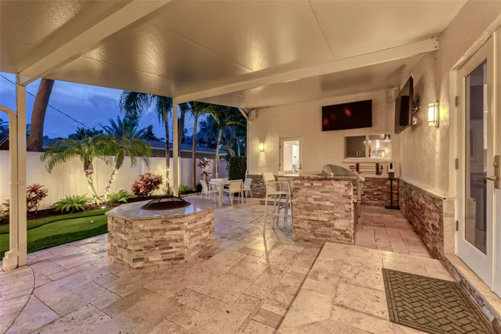 Covered Patio with outdoor kitchen, fire pit, heated pool & spa