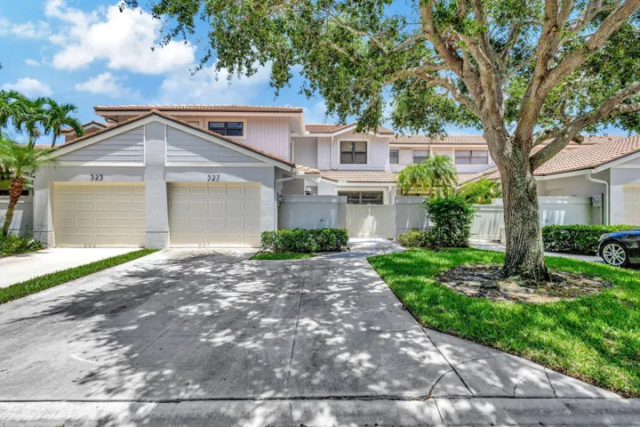 Located directly on the Champion Golf Course, this two-level residence features impact windows, doors, and sliding glass doors throughout, along with a one-car garage, tile roof, and landscaped exterior.