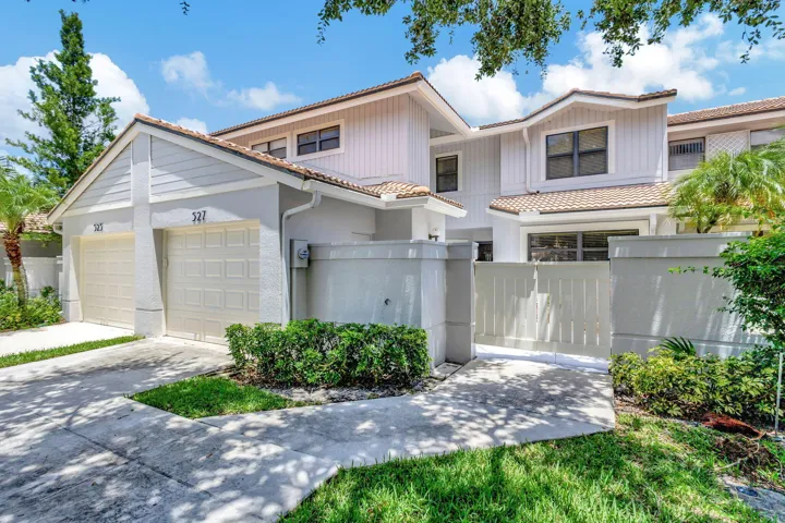 On the Champion Golf Course, this 3BR/3BA residence features impact windows, doors and sliders throughout, a ground-floor bedroom and full bath, and a one-car garage.
