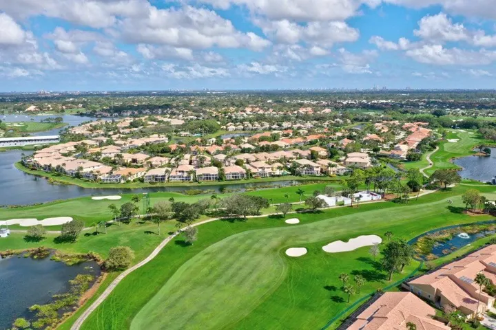 Expansive golf course setting with multiple greens and sand traps