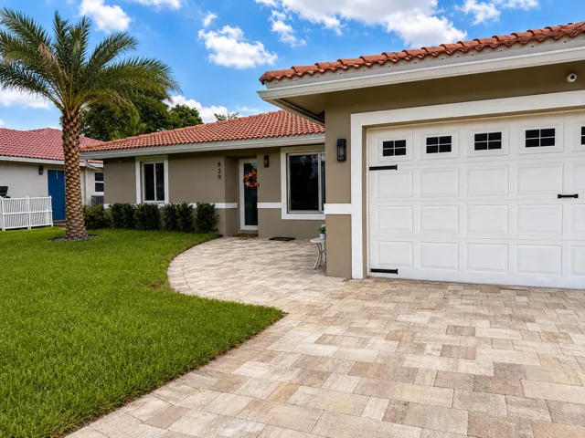 Stucco exterior with a terracotta tile roof