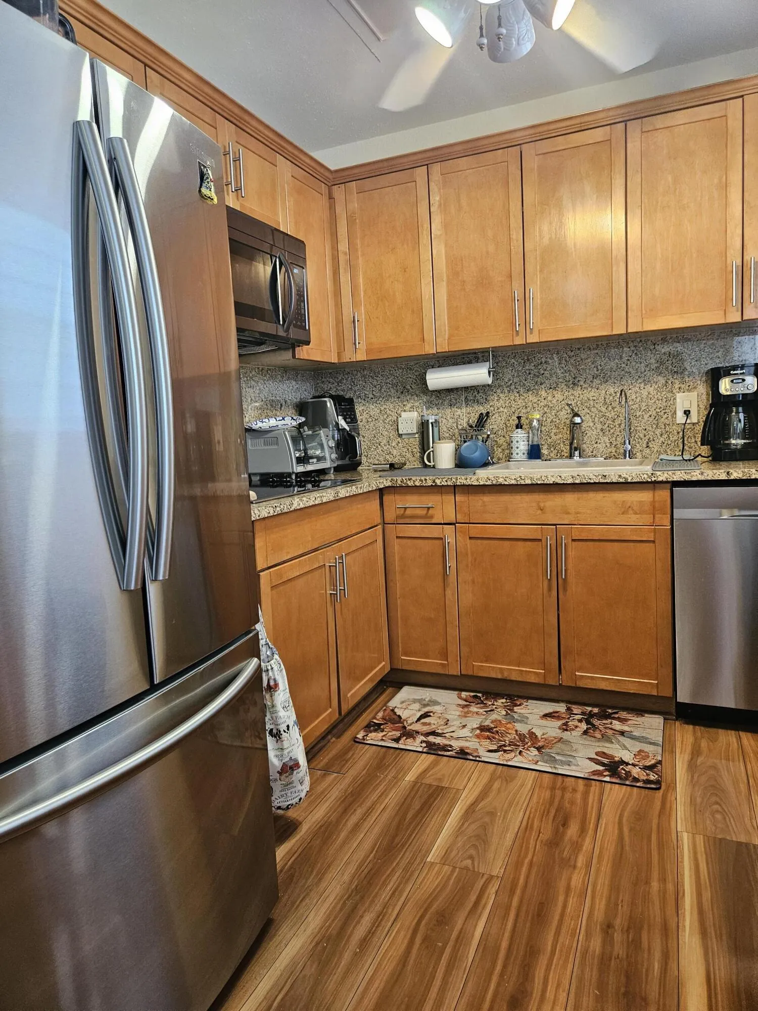 SS Microwave, Refrigerator, Dishwasher. Has cooktop.