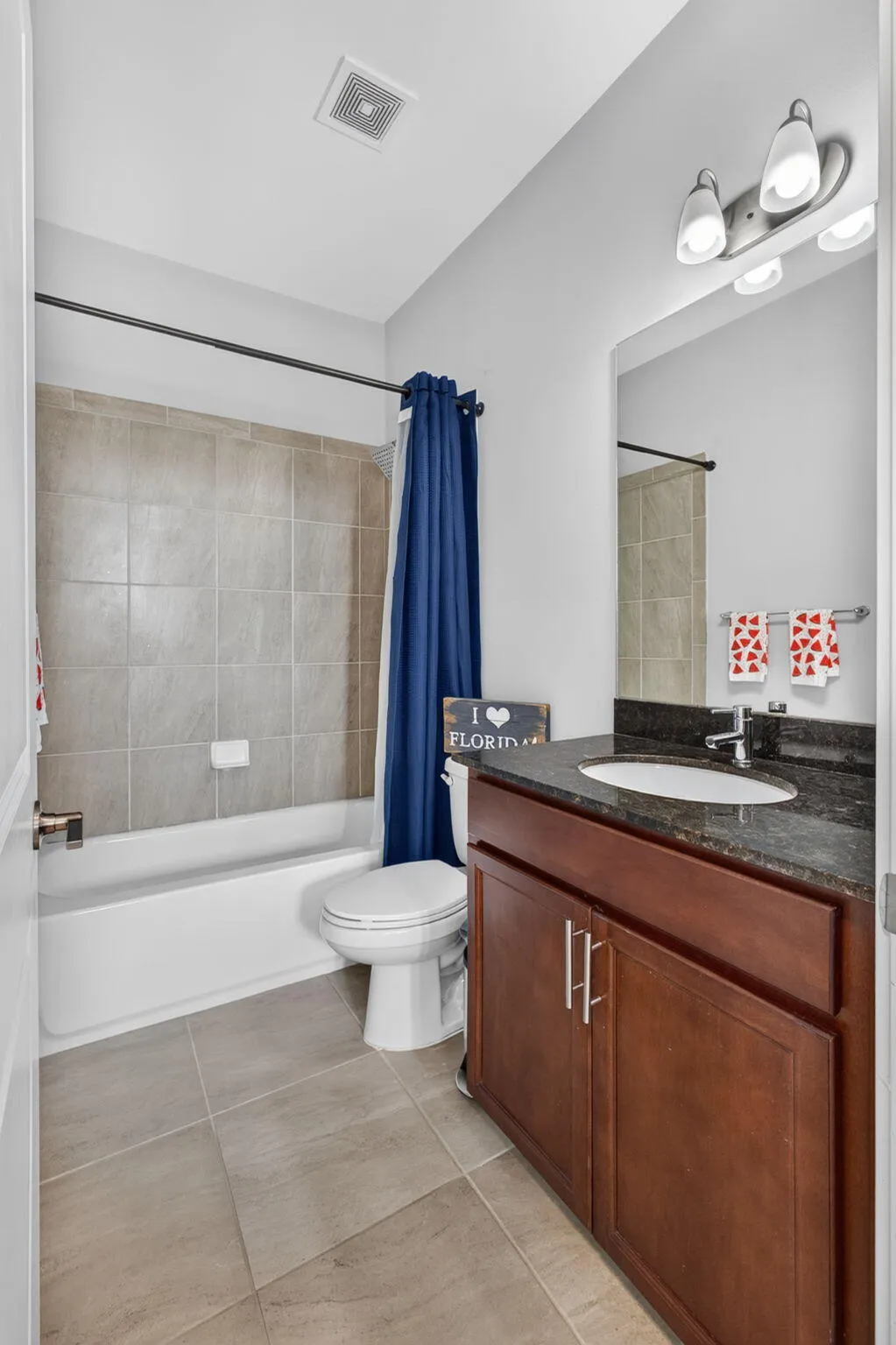 Guest bath with counter height vanity and unermount sink.