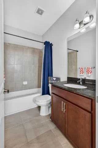 Guest bath with counter height vanity and unermount sink.