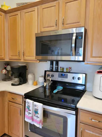 Very Large Kitchen, closer view of the cabinets and counters, not the crown molding on cabinets.