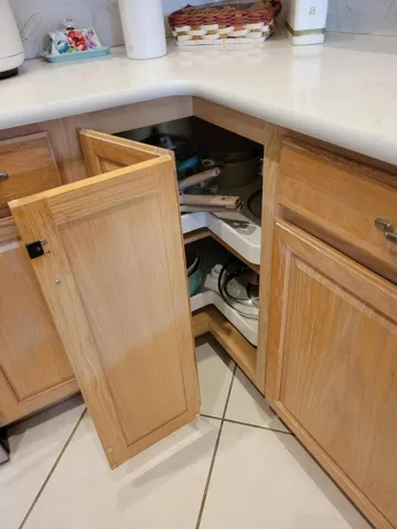 Door opens to reveal a Lazy Susan, perfect for canned items or larger pots and pans or do both.