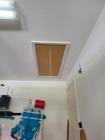 Ohhh, nice a pull-down ladder with attic storage !