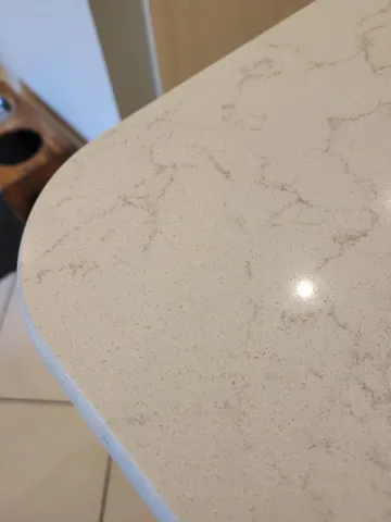 close-up of counters in kitchen...sleek, cool and guaranteed not to stain, chip etc.