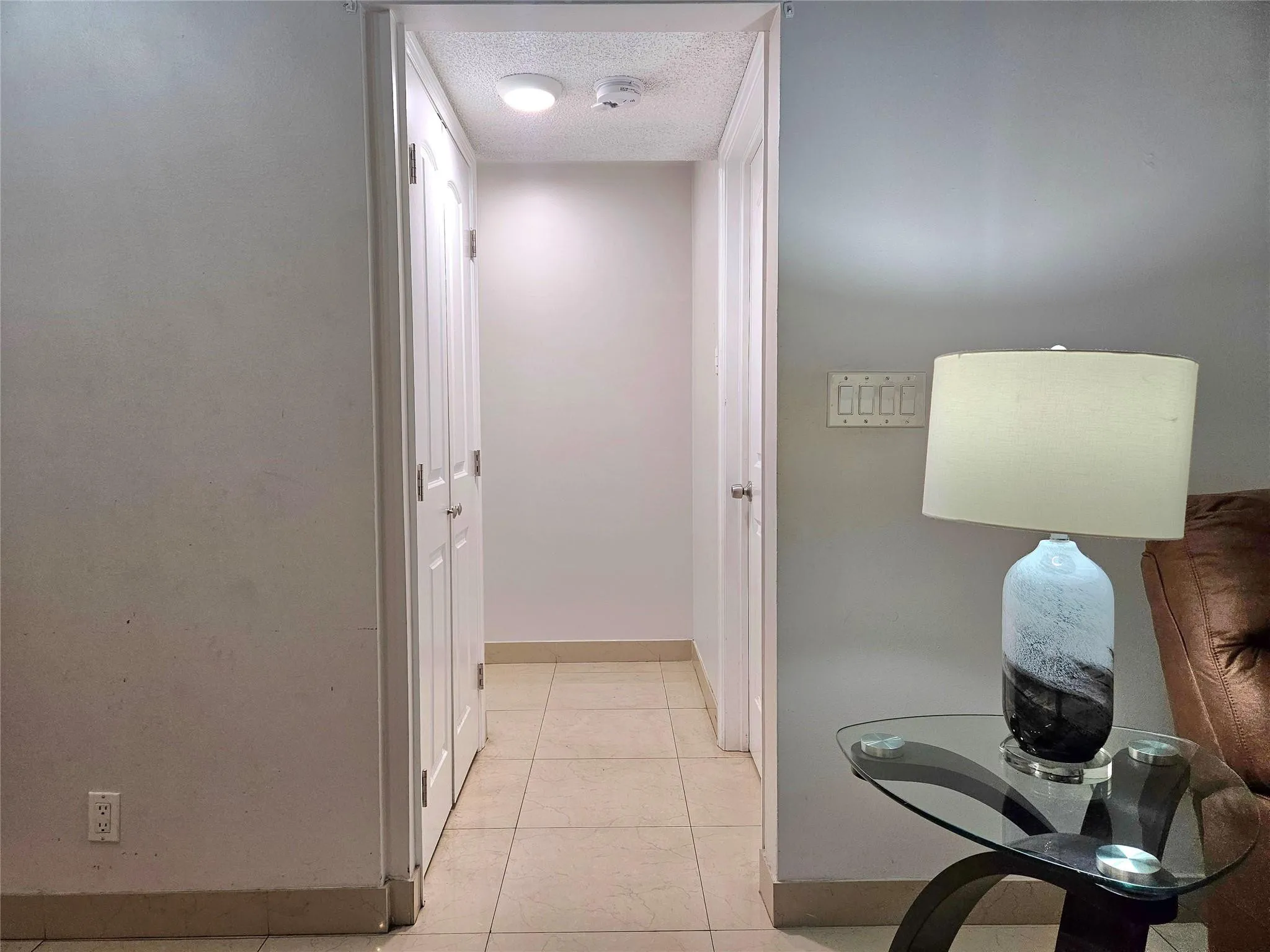 HALLWAY LEADING TO BEDROOM, BATHROOM & LAUNDRY