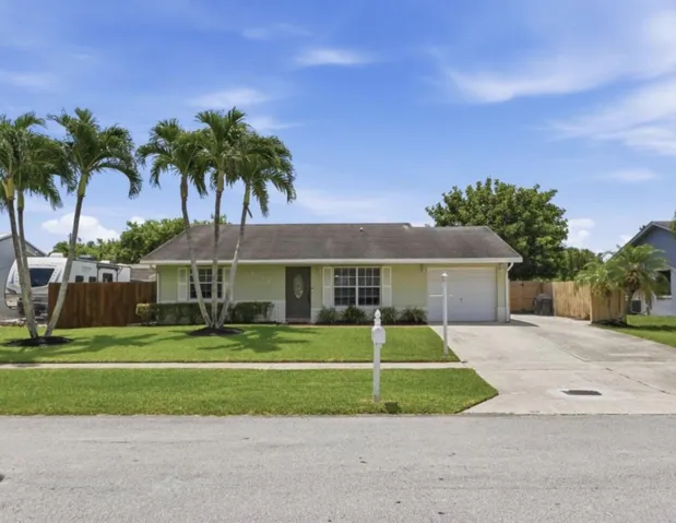 Front of home with large driveway
