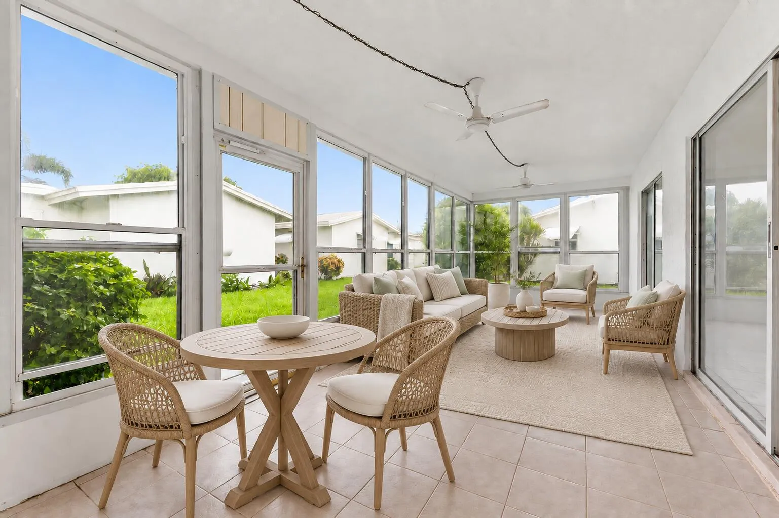 Large enclosed porch with spacious views. Faces East for those gulfstream breezes. Virtually staged.