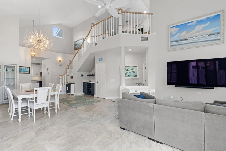 Looking from living room to to dining area and loft