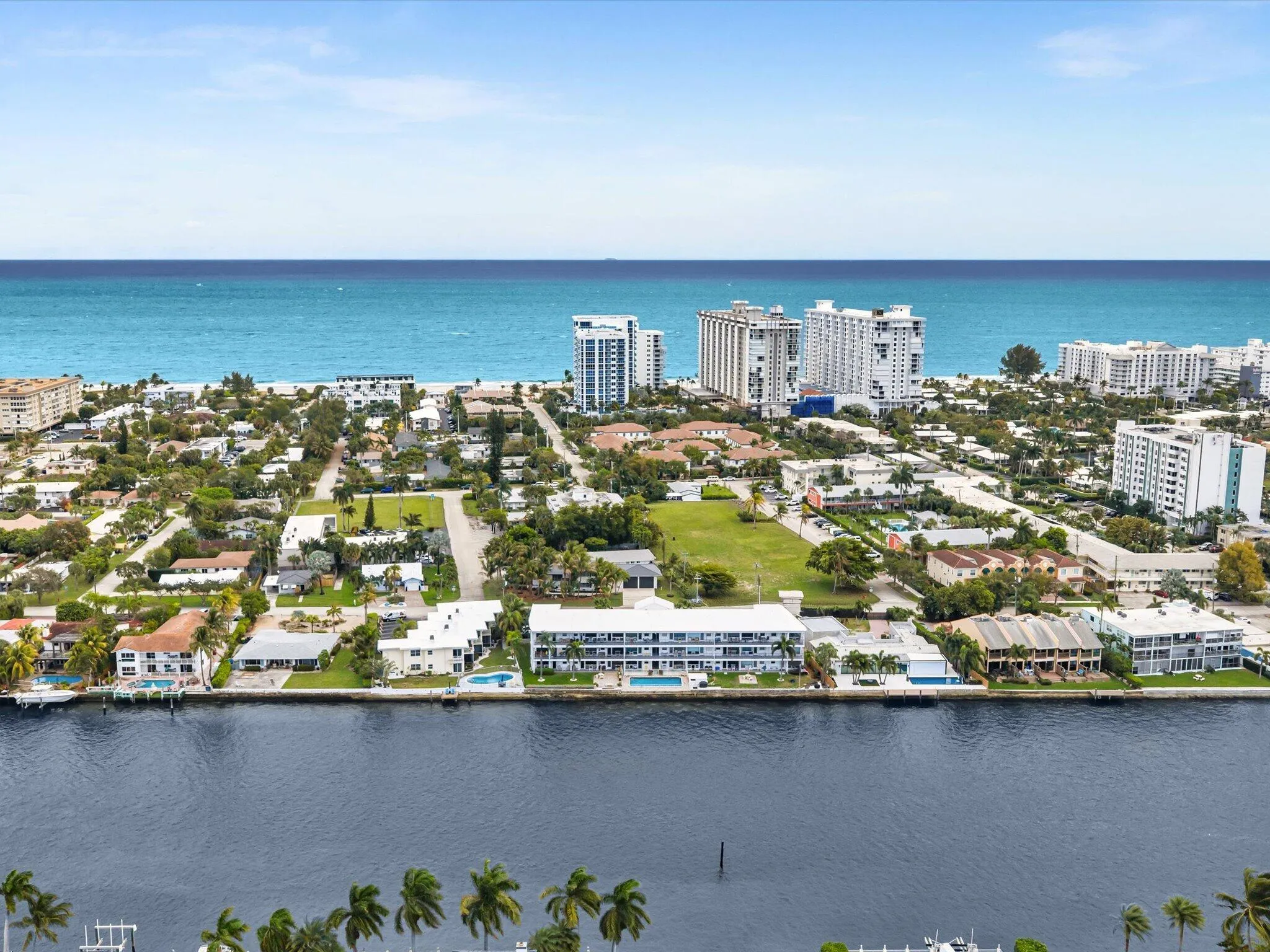 Waterfront property with direct ocean access, featuring a private dock and swimming pool