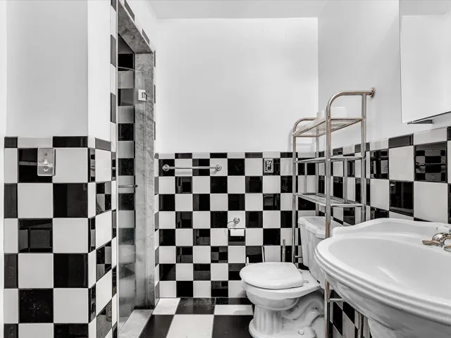 Black and white checkerboard tile flooring and wainscoting