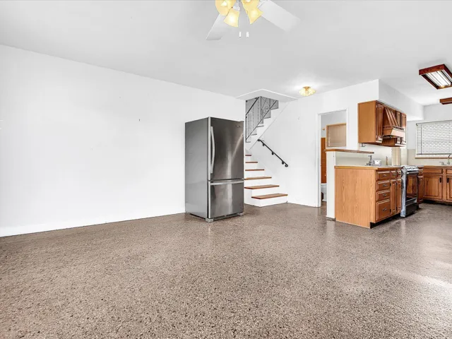Terrazzo-style flooring extends through the open concept space