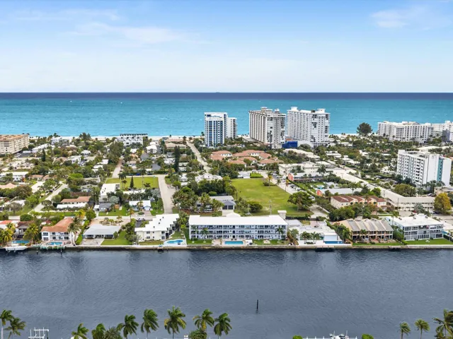 Waterfront property with direct ocean access, featuring a private dock and swimming pool