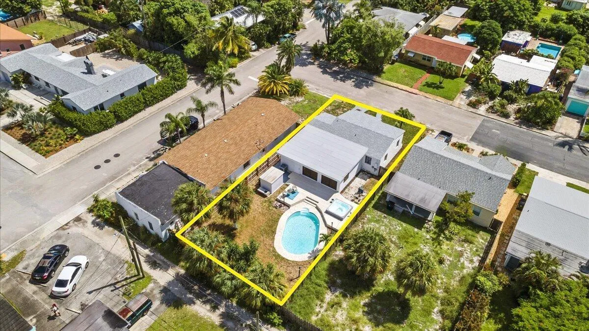 Property featuring a private swimming pool, integrated hot tub, and surrounding patio area