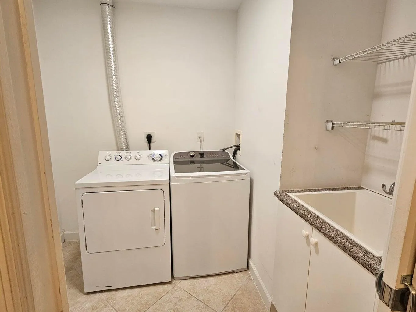 Next to kitchen laundry room with sink