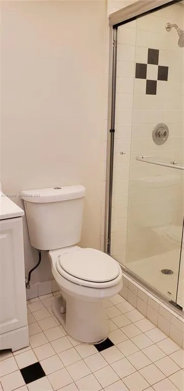 2nd View of Master Bathroom with Newer Comfort Height Toilet and Sliding Shower Door