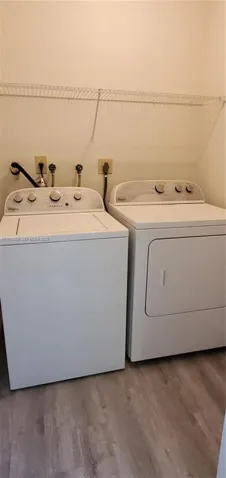 View of Laundry Room with New Flooring and Shelving
