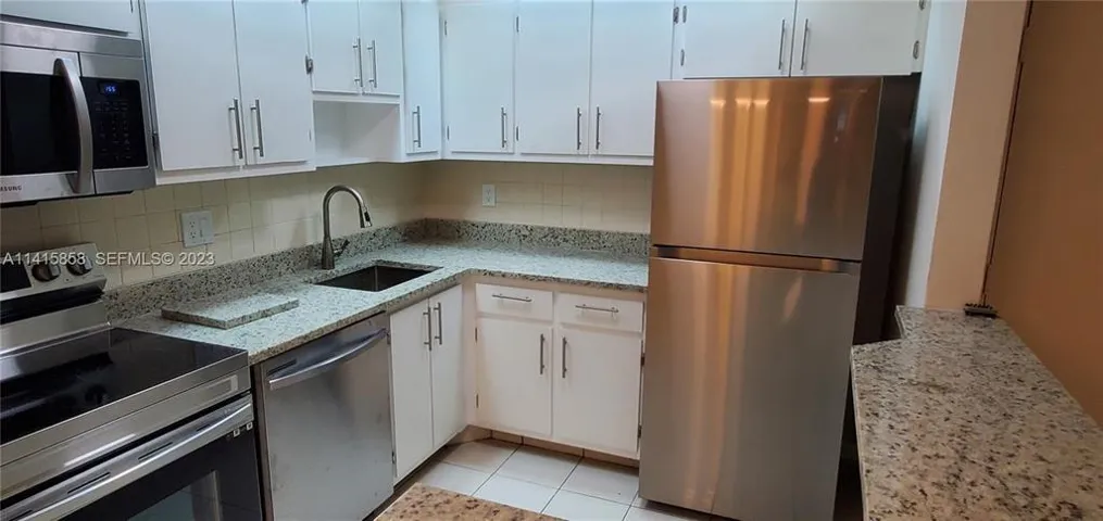 Renovated Kitchen with all Stainless Steel Appliances, Large Stainless Steel Sink, Granite Counters and Backsplash