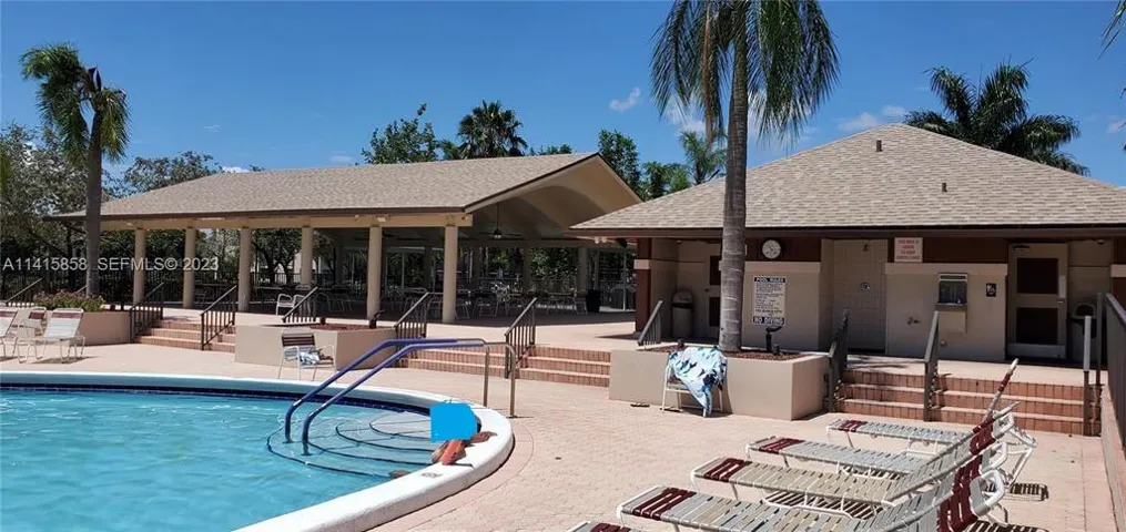 View of Pool, Bathroom Shower Area and Large Outdoor Covered Area
